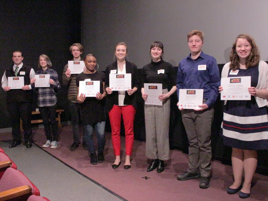 Poetry Out Loud 2016-2017 participating students standing in a group with their participation certificates.