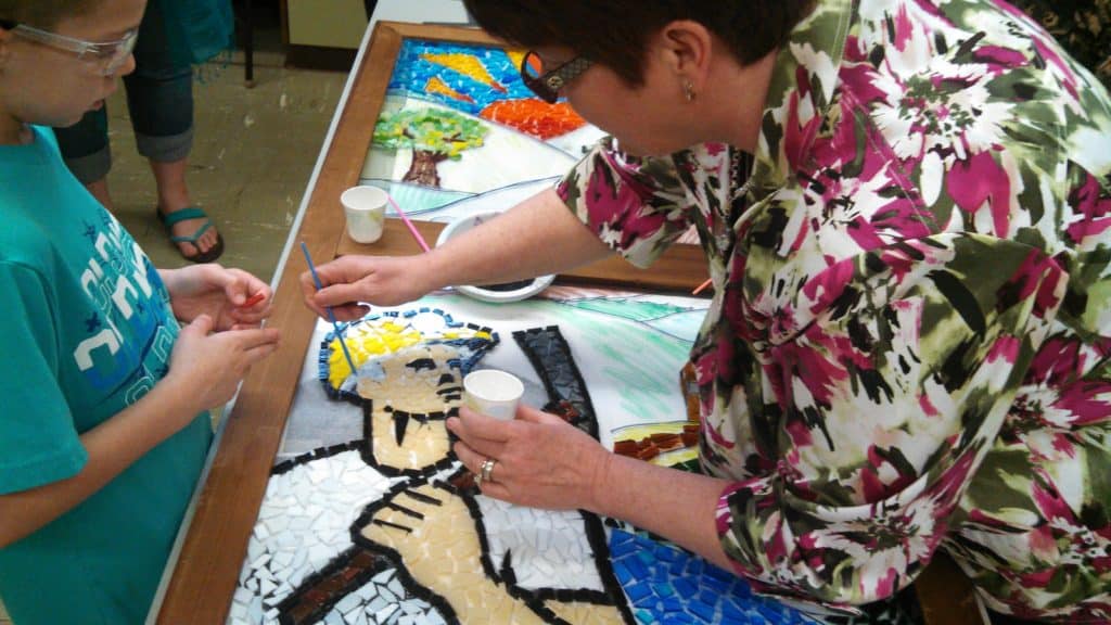 2013 Representative Pam Snyder learning how to create a glass mosaic mural with Bobtown Elementary students